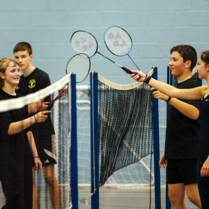 Juniors tapping rackets
